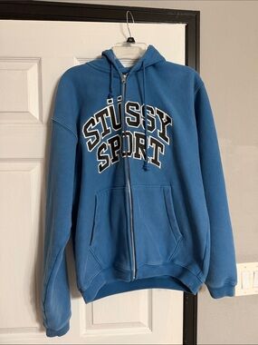 Stussy Blue Zip-Up Hoodie with Stussy Sport Arch Logo